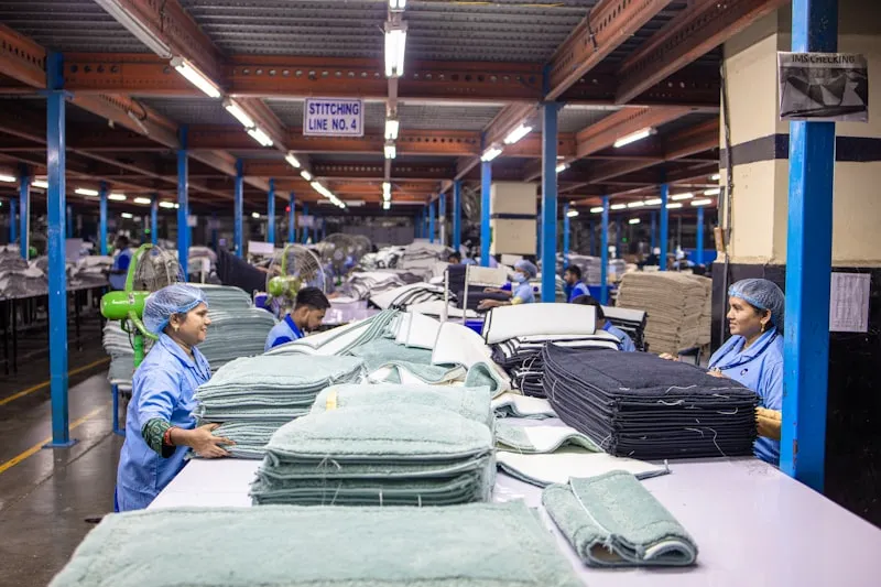 Textile workers sorting fabric at a manufacturing facility
