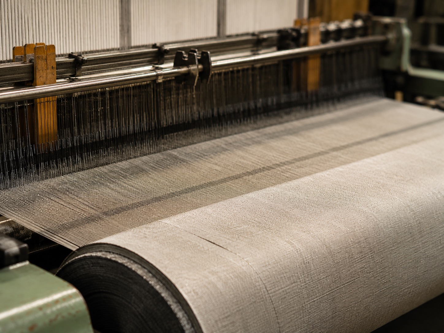 Power loom weaving fabric onto the roll at the Mohata facility